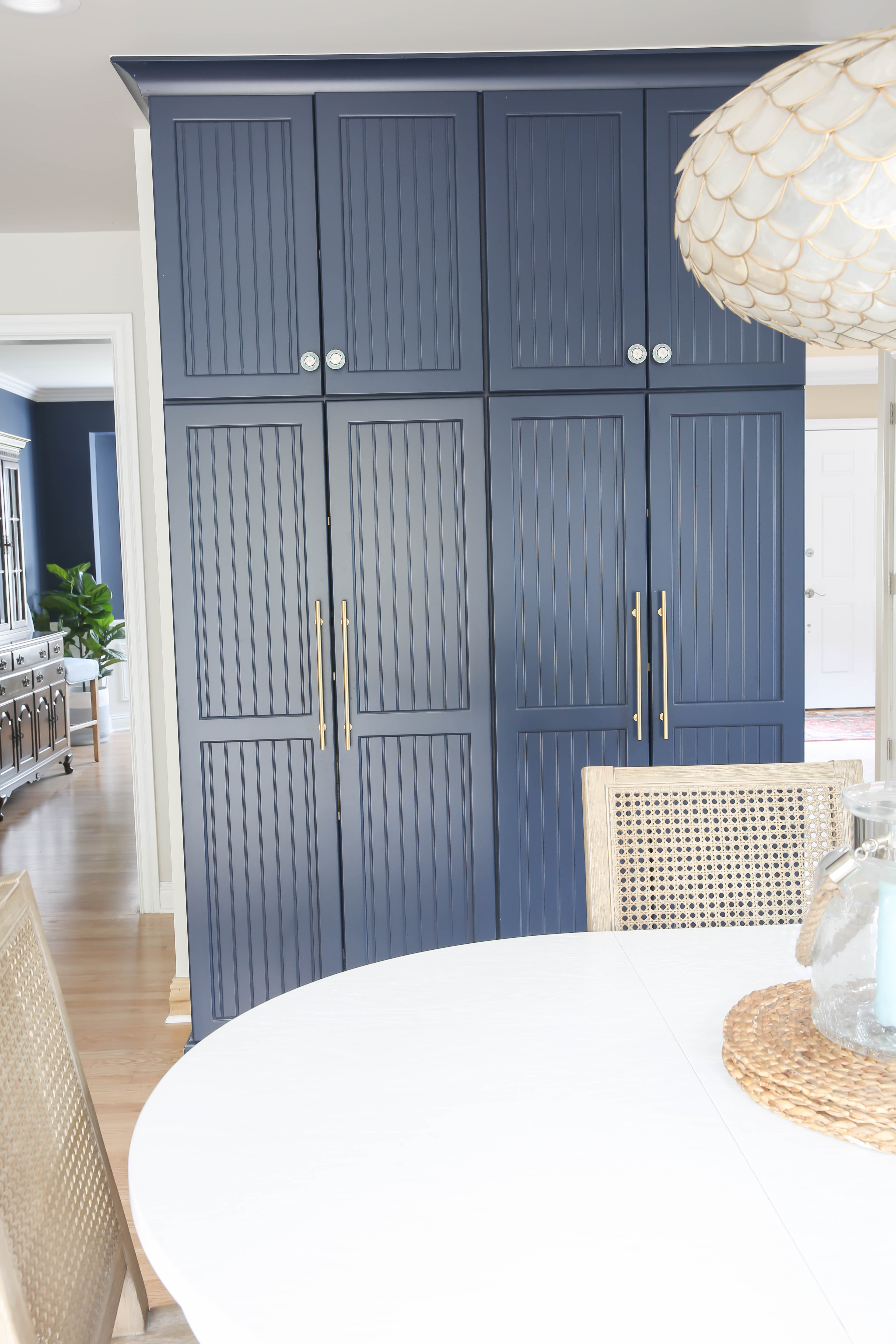 Classic White Kitchen Remodel with Navy Blue Pantry Cabinets | Newport Lane